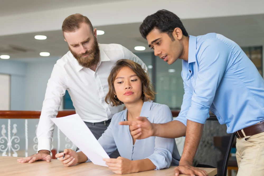 A team planning services together around a table